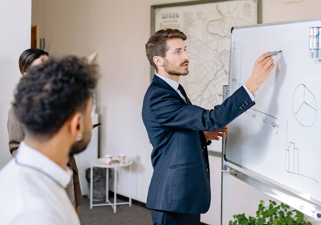 Man Drawing on Whiteboard